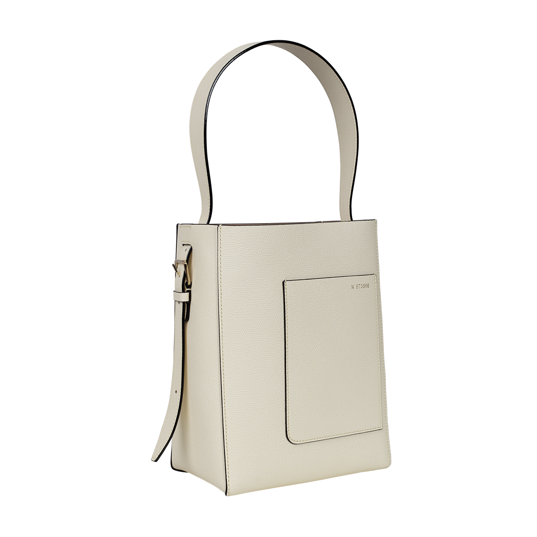 Small Ivory Bucket Bag | Side view of Small Ivory Bucket Bag VALEXTRA