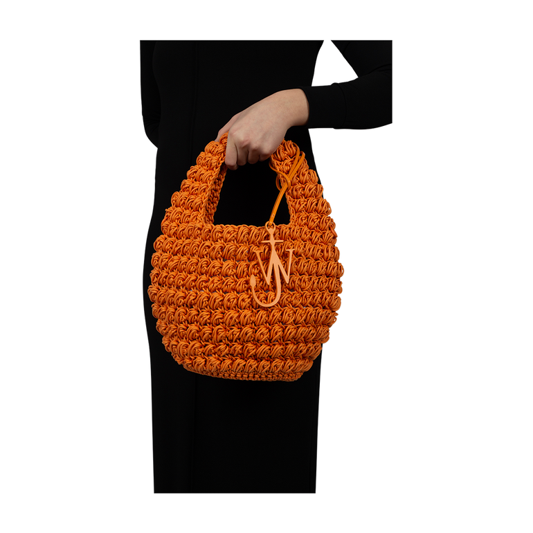 Popcorn Basket Top-Handle Bag | On-Model view of Popcorn Basket Top-Handle Bag J.W. ANDERSON