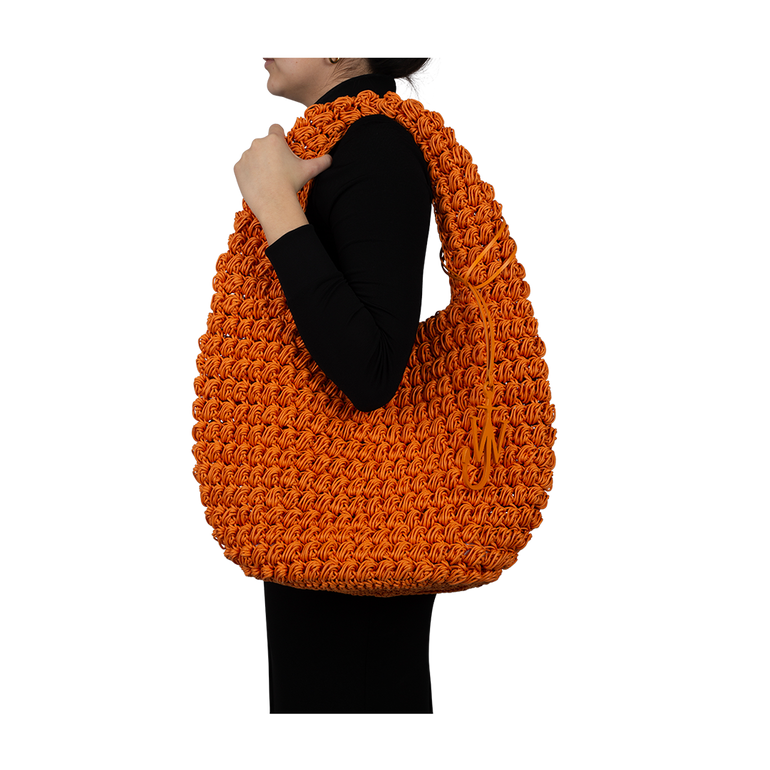 Large Orange Popcorn Basket Hobo Bag | On-Model view of Large Orange Popcorn Basket Hobo Bag J.W. ANDERSON