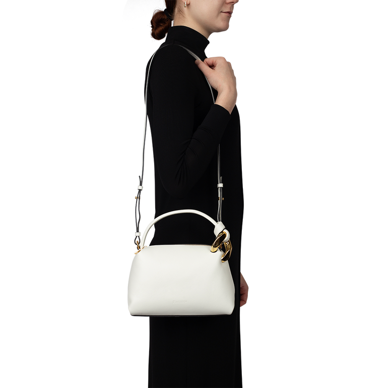 Small Corner Bag Off-White | On-model view of Small Corner Bag Off-White J.W. ANDERSON