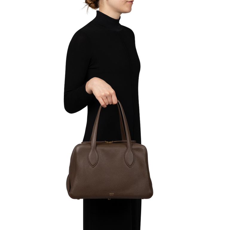 The Medium Maeve Bag | On-model view of The Medium Maeve Bag KHAITE