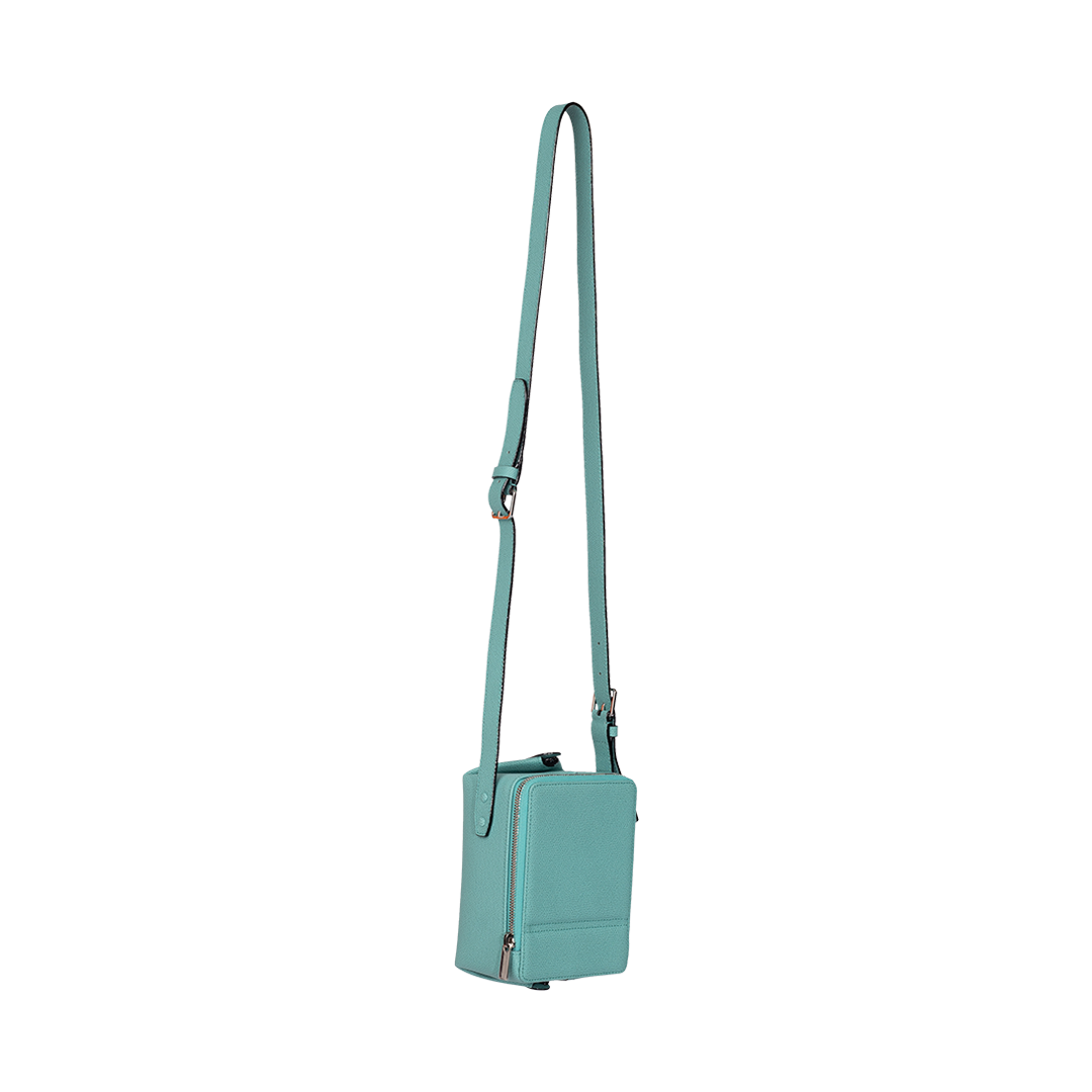 Tric Trac Crossbody Bag | Side view of Tric Trac Crossbody Bag in Mint VALEXTRA