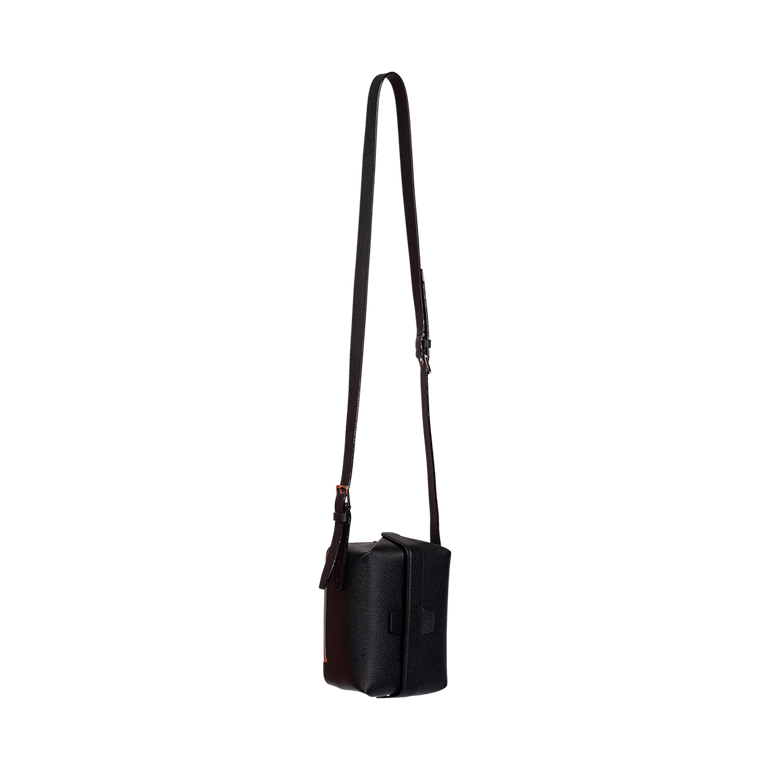 Tric Trac Crossbody Bag | Side view of Tric Trac Crossbody Bag in Black VALEXTRA